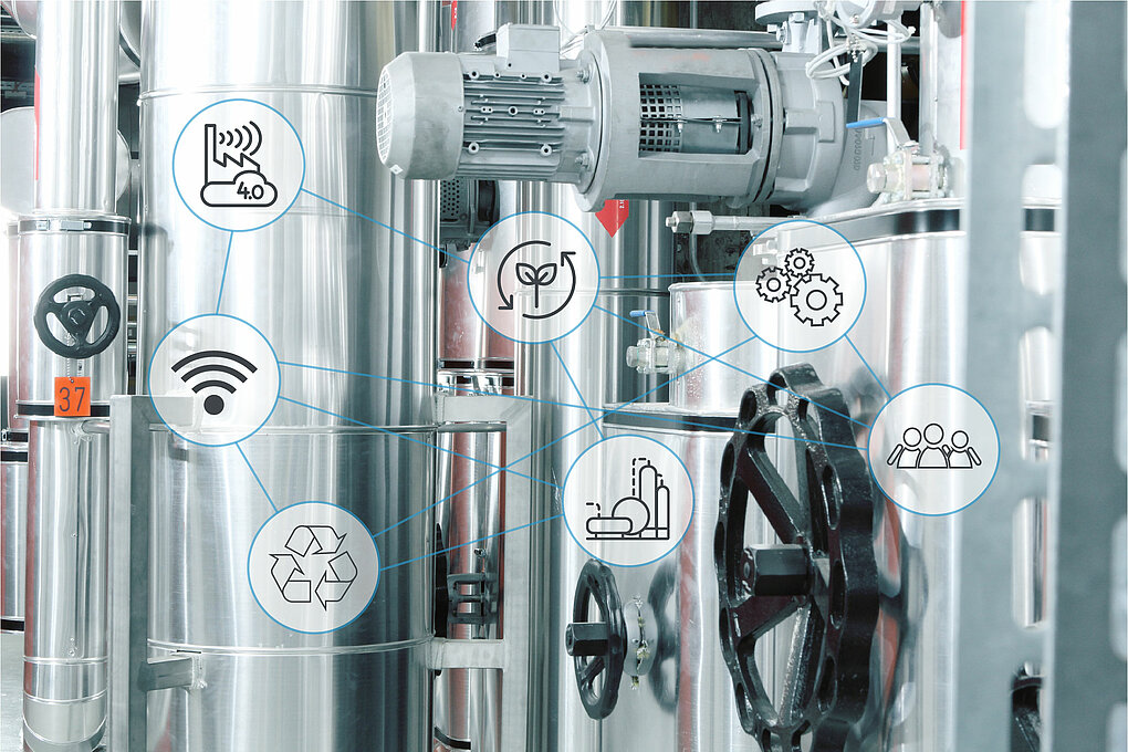 In chemical production, there are numerous starting points for reducing the amount of material and energy used. The photo shows metallic pipes and lines, over which various icons symbolizing the areas of sustainability, digitization and networking are laid.